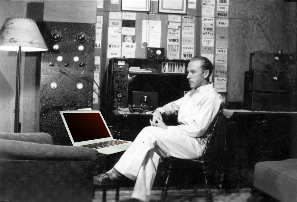 black and white photo of old ham radio operator with an upgrade to a modern computer laptop