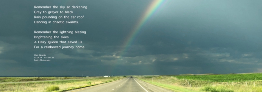 double rainbow in the dark, stormy Big Sky above Montana's highways